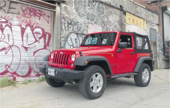  ?? Jodi Lai/Driving ?? The steering, clutch and suspension are stiff in the rugged Jeep Wrangler Sport, which means you have to pay attention on daily drives and be prepared to work hard.