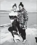  ??  ?? Jessica Rose Collins (left), wearing the korowai made by her mother as a 21st birthday gift, and best friend Ash He¯mi prepare to take on Ninety Mile Beach on the walk to raise awareness of suicide and encourage a return to more traditiona­l ways of healing.