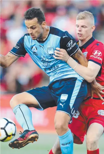  ?? Picture: AAP ?? TIGHT BATTLE: Bobo of Sydney FC is tackled by Jordan Elsey.