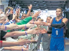  ?? AP ?? The Thunder’s Russell Westbrook is greeted by fans in Orlando.