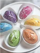  ?? PROVIDED BY LOHCALLY ARTISAN CHOCOLATE ?? Lohcally Artisan Chocolate’s handmade bunny truffles come in several flavors and its Easter pastels are hand-painted using all-natural colored cocoa butters.