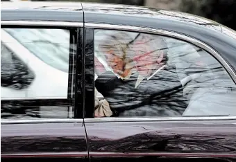 ?? FRANK AUGSTEIN THE ASSOCIATED PRESS ?? King Charles III waves as he and Queen Camilla leave Clarence House in London by car in London on Tuesday. After being diagnosed with cancer, Charles suspended public engagement­s but will continue with state business.