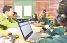  ?? Hearst Connecticu­t Media file photo ?? Students at the Elm City College Prep, an Achievemen­t First grade 5-8 Middle School in New Haven, study literature in small groups.