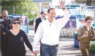  ?? (Hillel Maeir/TPS) ?? MOSHE FEIGLIN and his wife arrive at the polling station in Karnei Shomron, to cast their vote for Israel’s 21st Knesset in the April 9 elections.