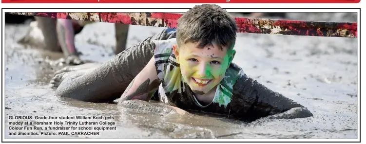  ?? Picture: PAUL CARRACHER ?? GLORIOUS: Grade-four student William Koch gets muddy at a Horsham Holy Trinity Lutheran College Colour Fun Run, a fundraiser for school equipment and amenities.