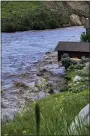  ?? PARKER MANNING VIA AP ?? In this image provided by Parker Manning, the flooding Yellowston­e River undercuts the river bank, threatenin­g a house and a garage in Gardiner, Mont., on June 13.