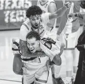  ?? Doug McSchooler / Associated Press ?? Texas Tech guard Kyler Edwards, top, had 12 points and six rebounds against Utah State.