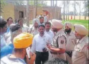  ?? HT PHOTO ?? Police at Kaler Kalan village in Gurdaspur district where the incident took place.