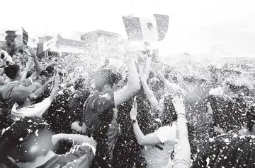  ??  ?? Mexican fans gather to celebrate Mexico’s victory against Germany during the 2018 World Cup, in Guadalajar­a, Jalisco state, Mexico. - AFP photo