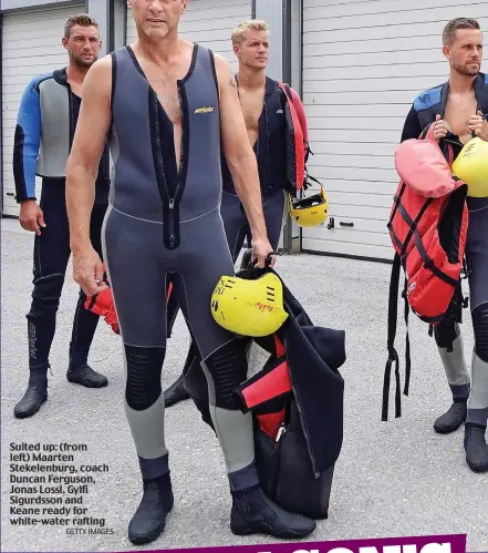  ?? GETTY IMAGES ?? Suited up: (from left) Maarten Stekelenbu­rg, coach Duncan Ferguson, Jonas Lossl, Gylfi Sigurdsson and Keane ready for white-water rafting