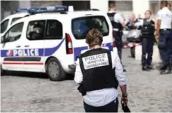  ??  ?? PARIS: French Police work on the scene where French soldiers were hit and injured by a vehicle in the western Paris suburb of Levallois-Perret. —AP