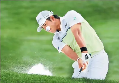  ?? CHRISTIAN PETERSEN / GETTY IMAGES / AFP ?? Hideki Matsuyama blasts out of a bunker on the second playoff hole at the Phoenix Open at Arizona’s TPC Scottsdale on Sunday. The Japanese star captured the tournament title for the second year in a row.