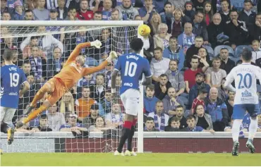  ??  ?? 0 Allan Mcgregor dives to save a shot by Robert Mudrazija, one of a string of fine stops by the keeper.