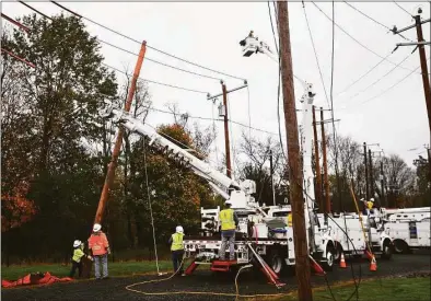  ?? Brian A. Pounds / Hearst Connecticu­t Media file photo ?? Eversource Energy workers demonstrat­e the steps involved in power restoratio­n at the company’s training site in Berlin on Oct. 28, 2020.