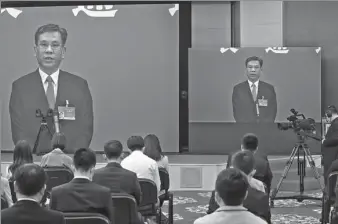  ?? KUANG LINHUA / CHINA DAILY ?? Minister of Finance Liu Kun addresses reporters’ queries via video link after the opening meeting of the fourth session of the 13th National People’s Congress in Beijing on Friday.