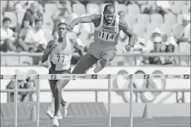  ?? Associated Press ?? On the road to recovery: In this Sept. 23, 1988, file photo, Edwin Moses of the United States, right, pulls ahead of Allan Ince of Barbados during heat competitio­n in the men's 400 meter hurdles at the Olympics in Seoul, Korea. Three months after...