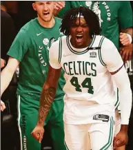  ?? Elsa / Getty Images ?? The Celtics’ Robert Williams III celebrates in the final minutes of a Game 4 at Brooklyn on April 25.