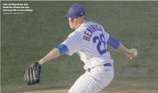  ??  ?? Cubs starting pitcher Kyle Hendricks allowed two runs and seven hits in seven innings. CHARLES REX ARBOGAST/AP