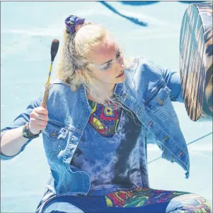  ?? JIM DAY/THE GUARDIAN ?? Emily Meadows beats a drum - an instrument used to powerful effect in The Dream Catchers.