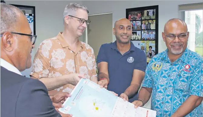  ?? Picture: SUPPLIED ?? FCEF chief executive officer Jonetani Tonawai, left, with United Nations Resident Coordinato­r in Fiji Dirk Wagener, FCEF president Vinay Narsey and senior education officer at the Ministry of Education Biu Colati with disaster awareness materials for approximat­ely 70,000 students ranging from Year 9 to Year 13 that will be distribute­d through the Ministry of Education.