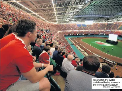  ?? ANDREW MATTHEWS ?? Fans watch the Wales match on the big screen at the Principali­ty Stadium
