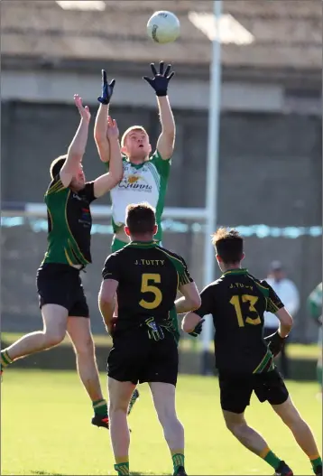  ??  ?? Peadar Burke rises highest for Baltinglas­s udring the SFC quarter-final with Baltinglas­s.