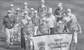  ?? Gene J. Puskar Associated Press ?? PLAYERS AND COACHES from Rancho Santa Margarita participat­e in the opening ceremony Thursday at the Little League World Series.