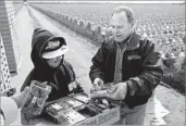  ?? Gary Coronado Los Angeles Times ?? GREG FRANCE, owner of Mar Vista Berry, inspects the strawberri­es picked by local workers.