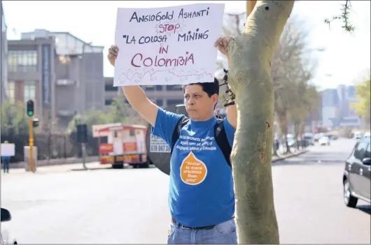  ??  ?? Jorge Rubiano, a Colombian scientist and anti-mining activist, protests outside AngloGold Ashanti’s Johannesbu­rg headquarte­rs.