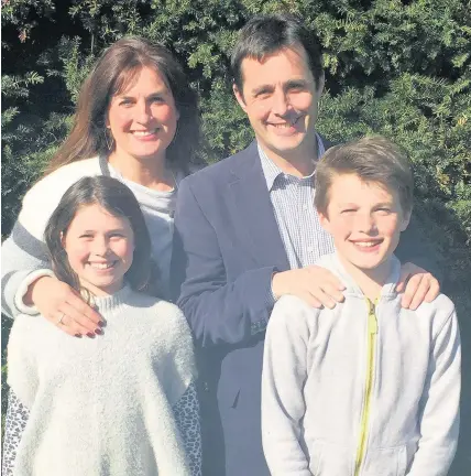  ??  ?? > New headteache­r of Christ College, Brecon, Gareth Pearson with wife Rhian, son Rhys and daughter Molly