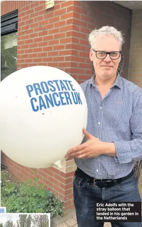  ??  ?? Eric Adolfs with the stray balloon that landed in his garden in the Netherland­s