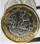  ??  ?? Coin of contention: The new one pound coin. — AFP