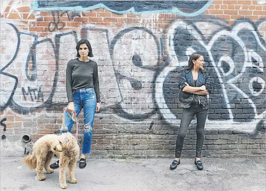  ?? Photograph­s by Mariah Tauger For The Times ?? THE SISTERS/FOUNDERS of luxury brand Newbark, Maryam (left, with dog Peaches) and Marjan Malakpour, are seen in L.A., where they produce their shoes.