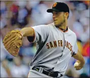  ?? MORRY GASH — THE ASSOCIATED PRESS ?? On July 6, 2010, Madison Bumgarner pitched eight shutout innings against the host Milwaukee Brewers to pick up the first of his 119 career victories with the Giants.