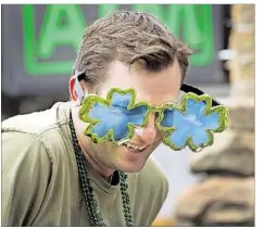  ?? RALPH BARRERA/AMERICAN-STATESMAN 2013 ?? Go green and shake your shamrocks at St. Patrick’s Day events all over town.