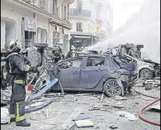  ?? AFP ?? Firefighte­rs intervene after a blast rocked a bakery on the corner of the streets Saint-cecile and Rue de Trevise in Paris.