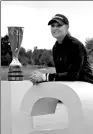  ?? LAURENT CIPRIANI / AP ?? Anna Nordqvist of Sweden poses with the trophy after winning the Evian Championsh­ip in Evian, France, on Sunday.