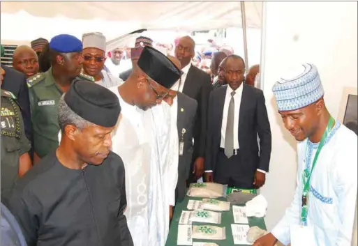  ??  ?? Osinbajo and Bello at an exhibition stand during the summit