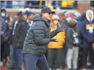  ?? Kirthmon F. Dozier, Detroit Free ?? Michigan Wolverines head coach Jim Harbaugh before action against the Ohio State Buckeyes Michigan Stadium on Nov. 27.