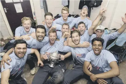  ??  ?? 2 Carlton skipper Ali Evans has his hands on the Scottish Cup at long last while his team-mates celebrate. His bighitting, below, earlier in the day yielded 61 valuable runs and helped his team post a competitiv­e total.
