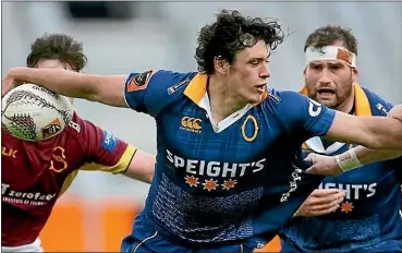  ?? DIANNE MANSON/ GETTY IMAGES. ?? Otago halfback Jonathan Ruru is tackled by Southland’s Jay Renton during the Mitre 10 Cup game in Dunedin last year.