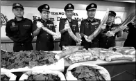  ?? VINCENT THIAN / ASSOCIATED PRESS ?? Seized pangolin scales and elephant tusks are displayed by customs officials after a news conference in Sepang, Malaysia, on Wednesday.