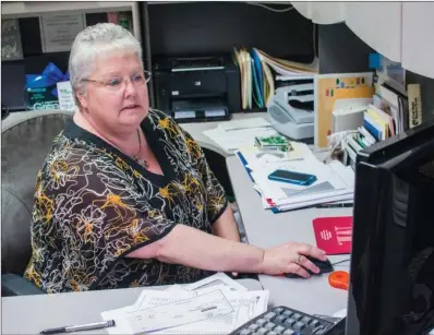  ?? WILLIAM HARVEY/RIVER VALLEY & OZARK EDITION ?? Treva Branscum sits in her office at HomeBank of Arkansas in Greenbrier, where she is vice president of operations. Branscum said she always wanted to be in banking, and she started in an entry-level position at a Conway bank and joined HomeBank of...