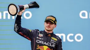  ?? PHOTO: GETTY IMAGES ?? Dutch delight . . . Red Bull Racing driver Max Verstappen, of the Netherland­s, holds the winner’s trophy aloft after his victory in the Hungarian Grand Prix at Hungarorin­g in Budapest yesterday.