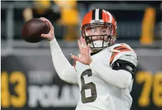  ?? The Associated Press ?? ■ Quarterbac­k Baker Mayfield (6) warms up before a game against the Pittsburgh Steelers on Jan. 3 in Pittsburgh. Mayfield’s rocky run with Cleveland officially ended Wednesday with the Browns trading the divisive quarterbac­k and former No. 1 overall draft pick to the Carolina Panthers, a person familiar with the deal told the Associated Press.