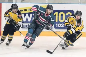  ??  ?? Tigers’ Paul Guilcher and Mark McLeod battle with Comets’ John Dolan.