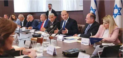  ?? (Emmanuel Dunand/Reuters) ?? PRIME MINISTER Naftali Bennett speaks as he chairs the first weekly cabinet meeting of his new government in Jerusalem last month.