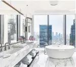  ?? ?? A soak in the Executive Cityscape room comes with a stunning view over the city.