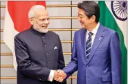  ?? REUTERS ?? Prime Minister Narendra Modi and Japan’s Prime Minister Shinzo Abe shake hands prior to their meeting at Abe’s official residence in Tokyo, Japan on Monday.