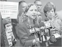  ?? Associated Press file ?? The Russian cyberattac­k that led to the release of DNC emails and the resignatio­n of Rep. Debbie Wasserman Schultz, center, as DNC chairwoman is now thought to have breached the private email accounts of more than 100 party officials and groups.